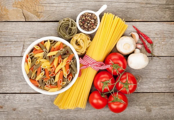 Pasta, tomatoes, mushrooms and spices — Stock Photo, Image