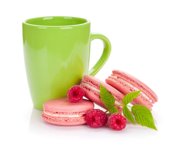 Macaron cookies and cup of drink — Stock Photo, Image