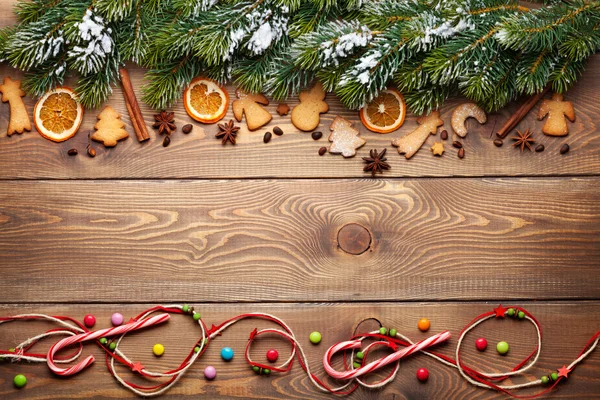 Snow fir tree, spices and gingerbread cookies — Stock Photo, Image