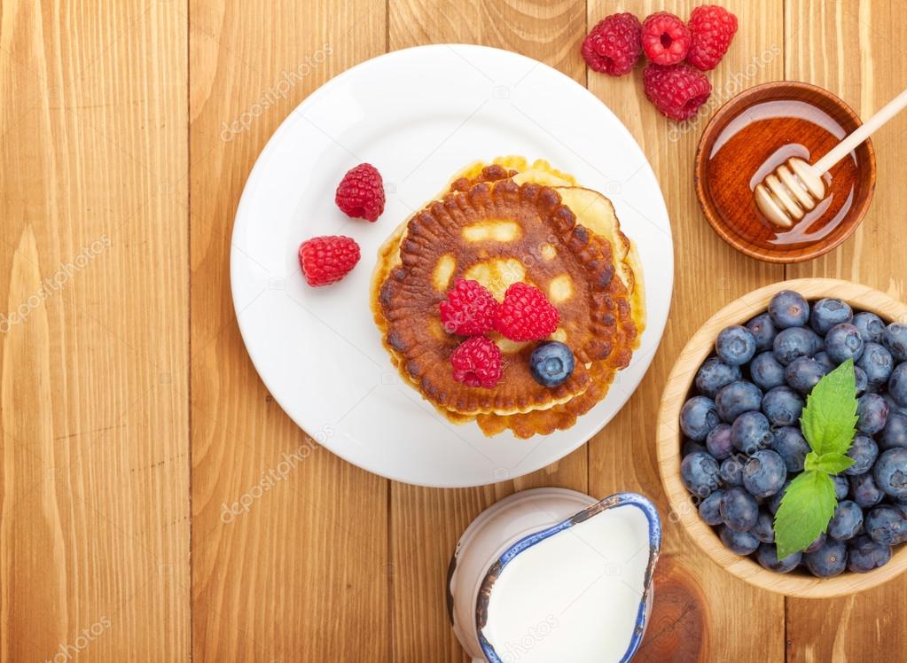 Pancakes with raspberry, blueberry, milk