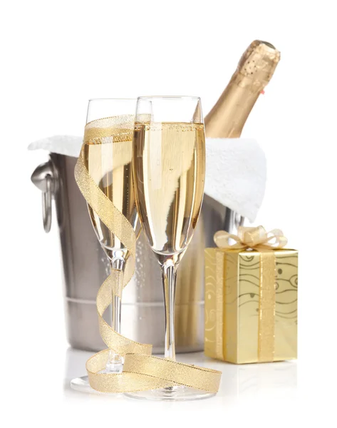 Champagne bottle, glasses and christmas gift — Stock Photo, Image