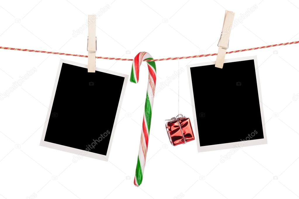 Photo frames and candy cane hanging on clothesline