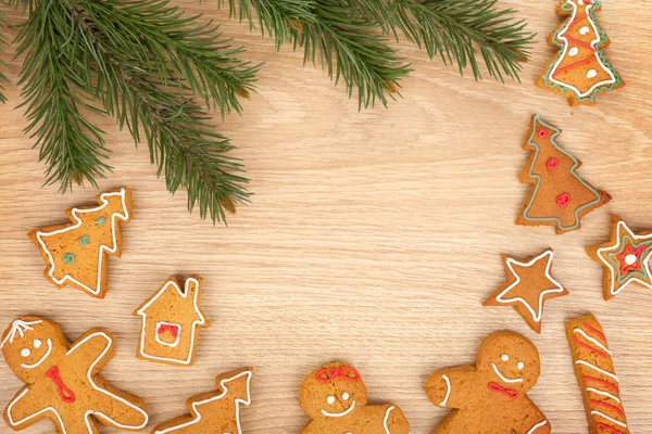 Christmas fir tree and gingerbread cookies — Stock Photo, Image