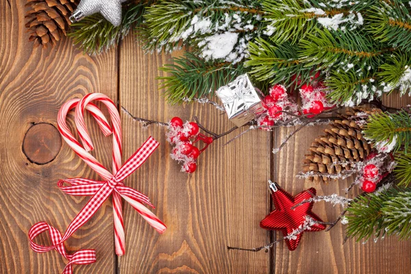 Candy canes and snow fir — Stock Photo, Image