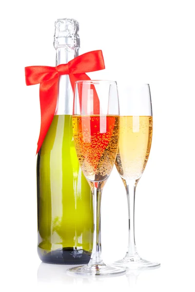 Champagne glasses and bottle with ribbon Stock Image