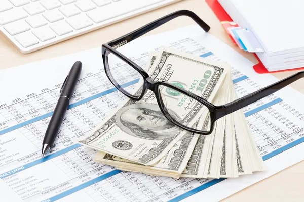 Office table with pc, supplies and money — Stock Photo, Image