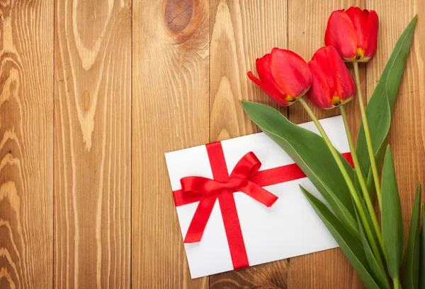 Fresh tulips and greeting card — Stock Photo, Image