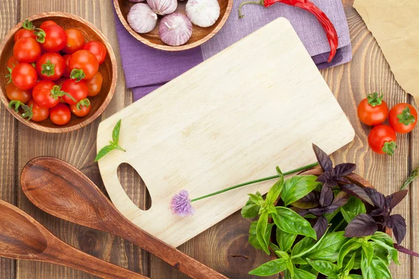 Fresh farmers tomatoes and basil on wood table — Stock Photo, Image