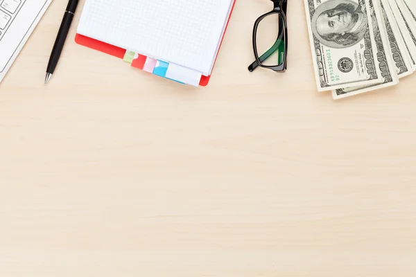 Office table with pc, supplies and money cash — Stock Photo, Image