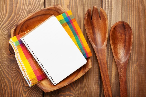 Wood kitchen utensils over wooden table background — Stock Photo, Image