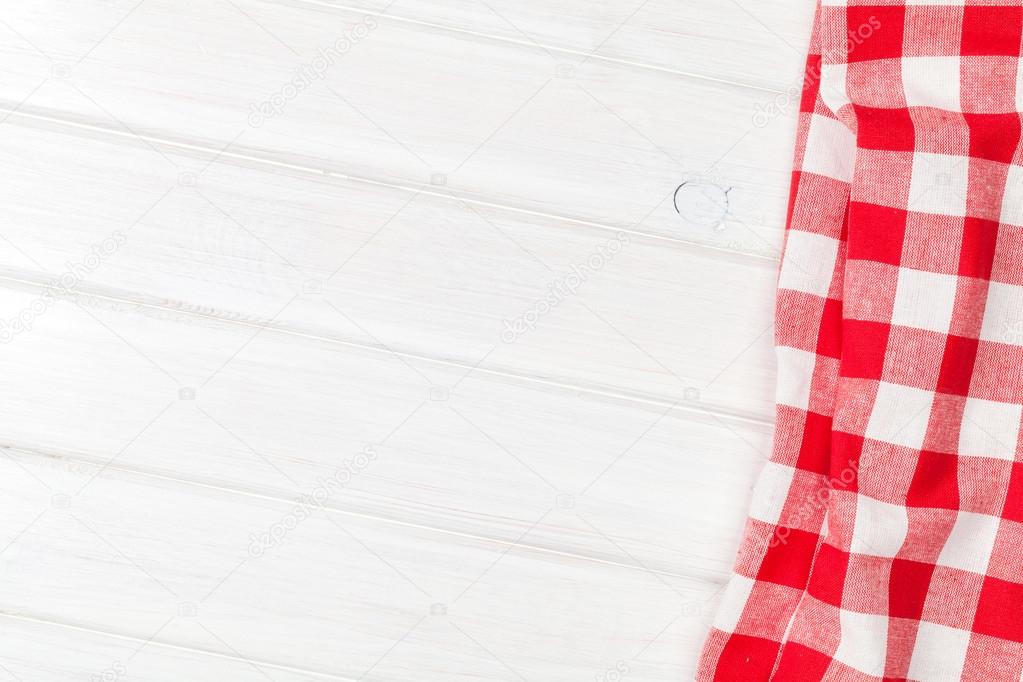 Red towel over wooden kitchen table