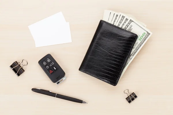 Money in wallet on wooden table