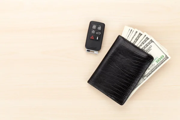 Money in wallet and car remote key — Stock Photo, Image