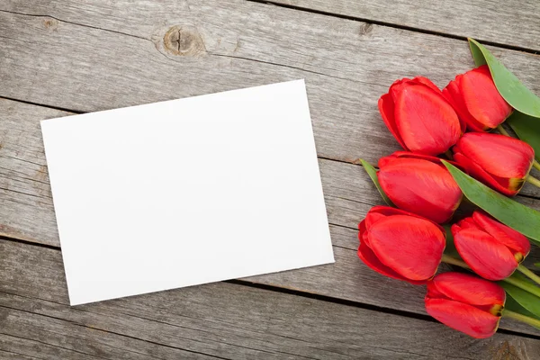 Fresh tulips and greeting card — Stock Photo, Image