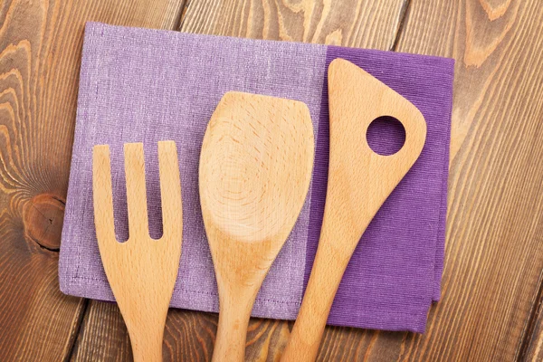 Wood kitchen utensils over wooden table — Stock Photo, Image