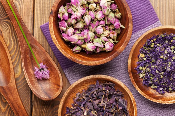 Spices and utensils over wooden table — Stock Photo, Image