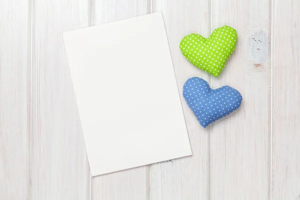 Photo frame or greeting card and handmaded valentines day toy hearts — Stock Photo, Image