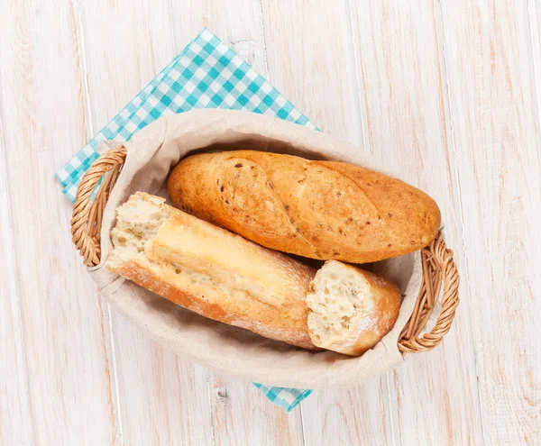 Fresh french bread in basket — Stock Photo, Image