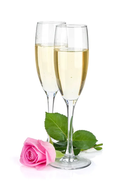 Two champagne glasses and pink rose flower — Stock Photo, Image