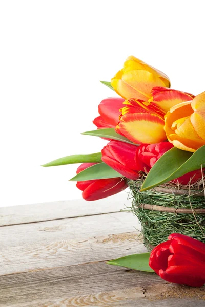 Fresh colorful tulips in basket — Stock Photo, Image