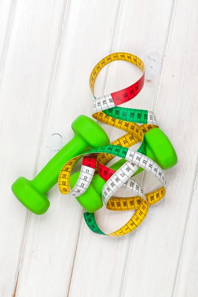 Dumbells and tape measure — Stock Photo, Image