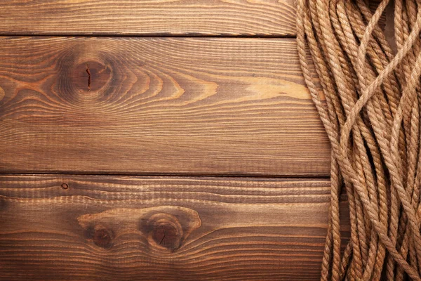 Drewniane tła z lina morskie — Zdjęcie stockowe