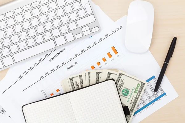 Office table with supplies and money cash — Stock Photo, Image