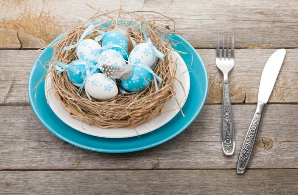 Easter eggs nest on plate — Stock Photo, Image