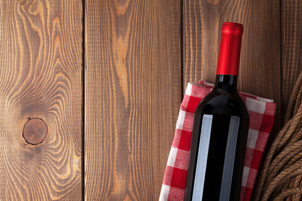 Red wine bottle over towel