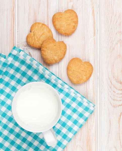 Milk and heart shaped cookies — Stock Photo, Image