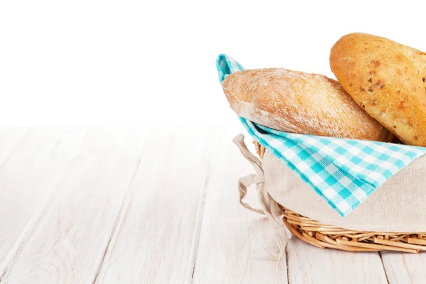 Fresh french bread in basket — Stock Photo, Image