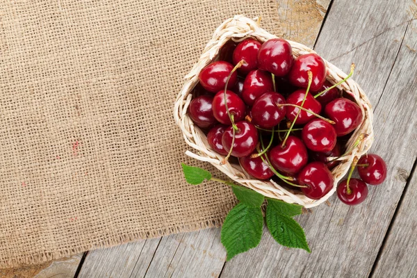 Ripe cherries on wooden table — Stock Photo, Image