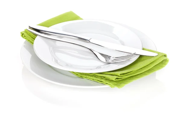 Fork and knife over plates — Stock Photo, Image