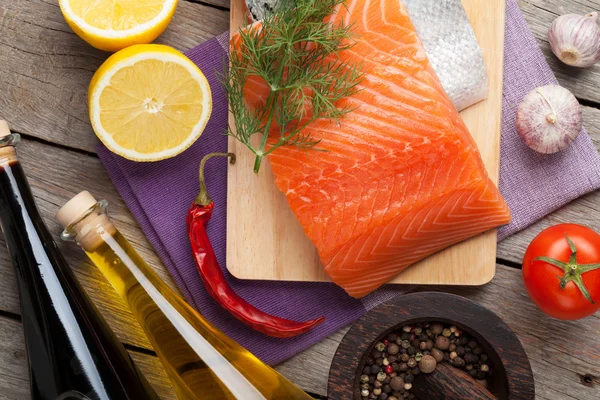 Salmon and spices on table — Stock Photo, Image