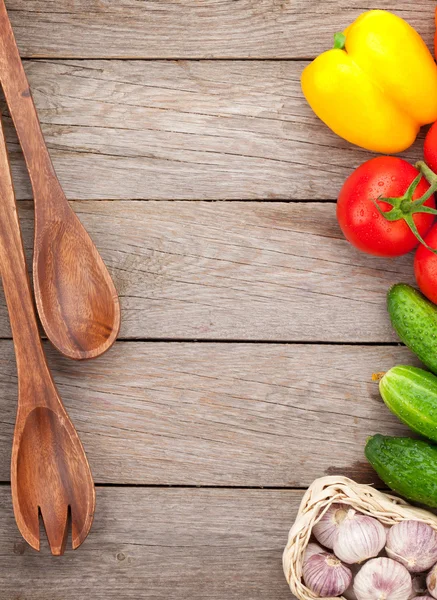 Vegetables and utensils on  table — Stock Photo, Image