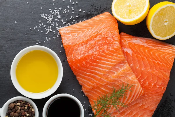 Salmon and spices on  table — Stock Photo, Image