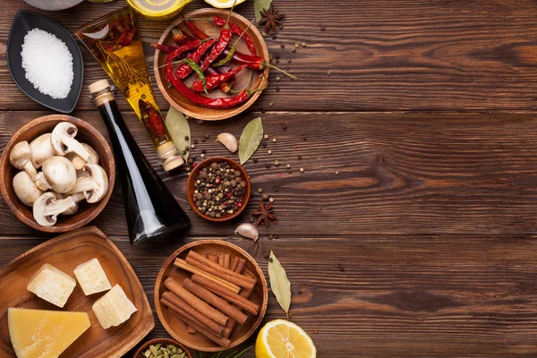 Various spices on wooden background — Stock Photo, Image