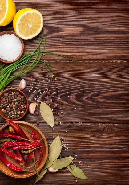 Various spices on wooden background — Stock Photo, Image