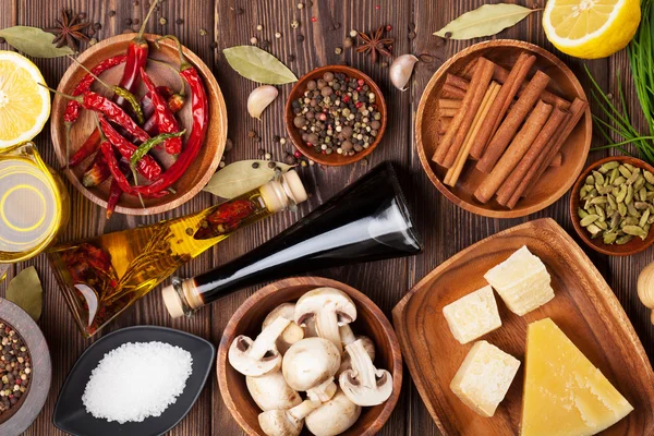 Various spices on wooden background — Stock Photo, Image