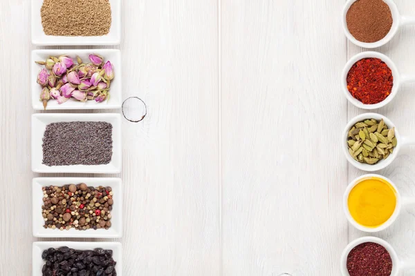 Various spices on white wooden background — Stock Photo, Image