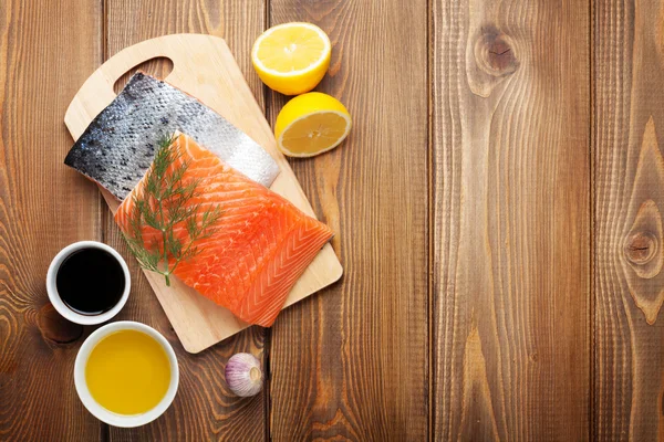 Salmon, spices and condiments — Stock Photo, Image