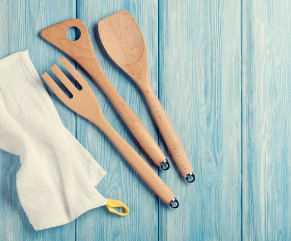 Kitchen cooking utensils over wooden table — Stock Photo, Image