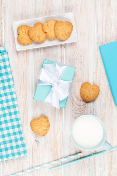 Cup of milk, heart shaped cookies — Stock Photo, Image