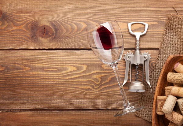 Red wine glass, corkscrew — Stock Photo, Image
