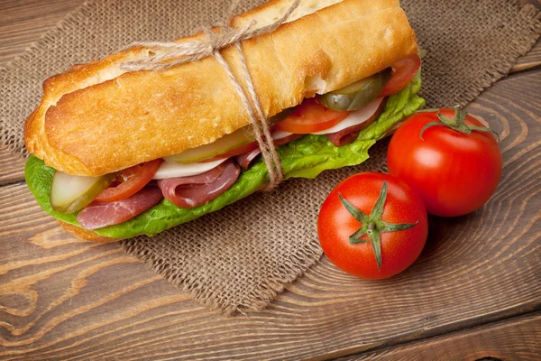 Sandwich with salad and tomatoes — Stock Photo, Image