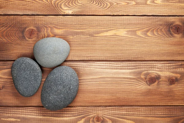 Wooden background with sea stones — Stock Photo, Image