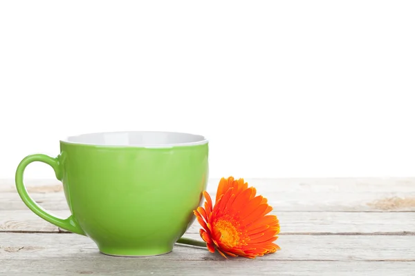 Cup of coffee and gerbera — Stock Photo, Image