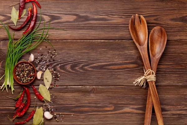 Various spices on wooden background