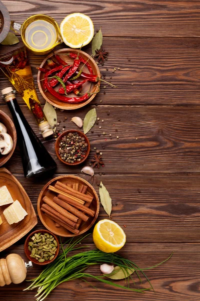 Various spices on wooden background — Stock Photo, Image