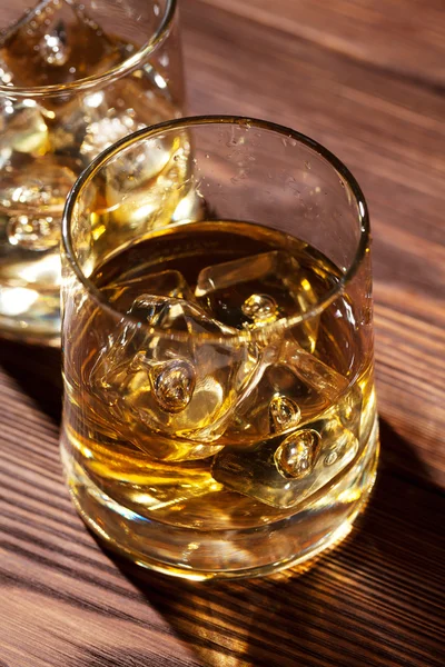 Glasses of whiskey with ice — Stock Photo, Image